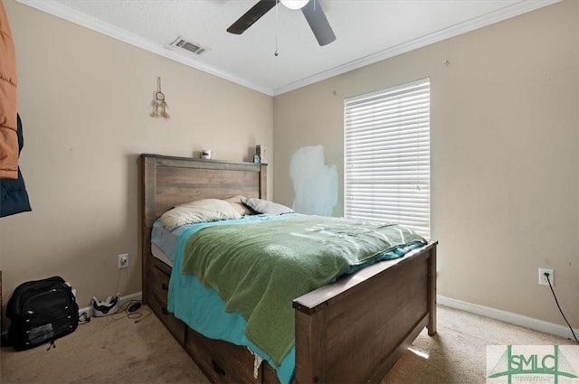 bedroom with ceiling fan, carpet floors, and ornamental molding