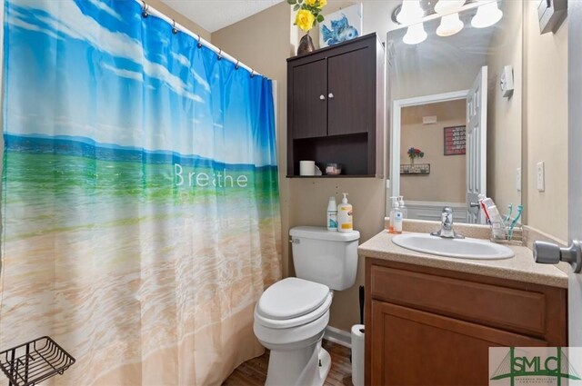 115 Crossing Cir, Rincon, GA 31326 - bathroom with toilet, vanity, and curtained shower