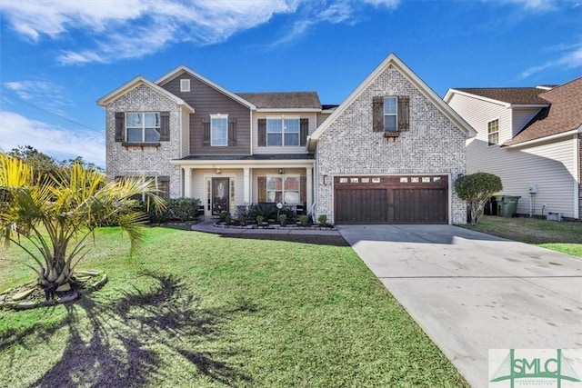 view of front of property with a garage and a front lawn