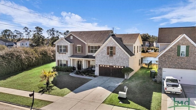 view of front of house featuring a front yard and a garage