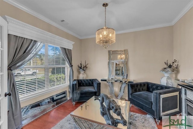 living room with a chandelier, hardwood / wood-style flooring, and crown molding