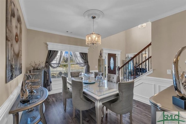 dining room featuring an inviting chandelier, dark wood-type flooring, and ornamental molding