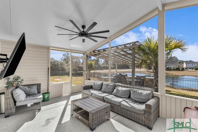 sunroom / solarium with lofted ceiling with beams, a water view, and ceiling fan