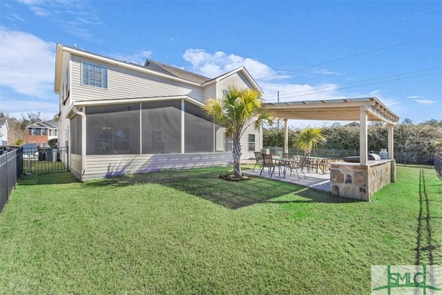 back of house with a patio, a yard, and a sunroom