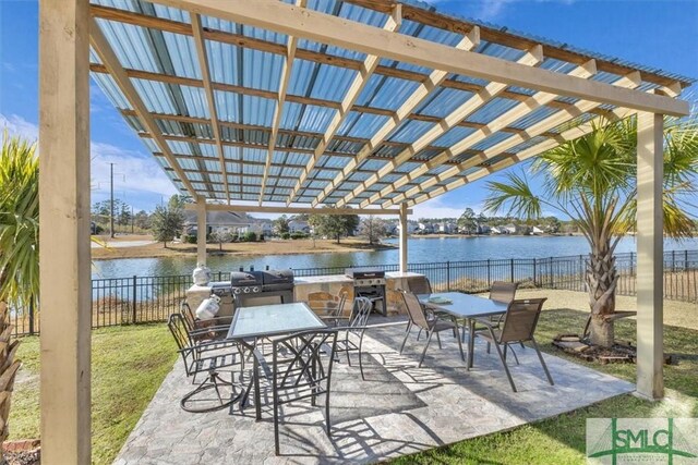 view of patio / terrace with a water view, area for grilling, and a pergola