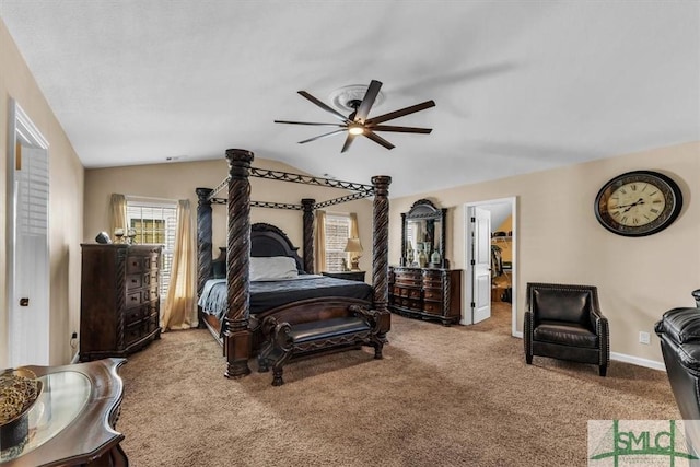 carpeted bedroom with ceiling fan and vaulted ceiling