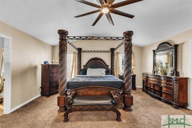 bedroom featuring carpet, vaulted ceiling, and ceiling fan