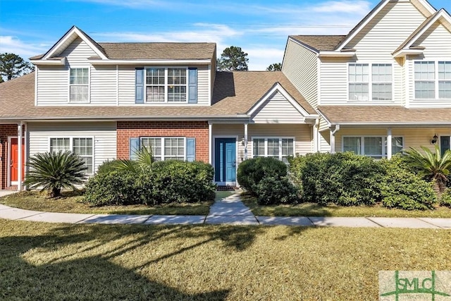 view of front of property with a front lawn