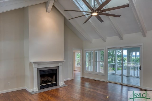 unfurnished living room featuring baseboards, a fireplace with flush hearth, wood finished floors, high vaulted ceiling, and beam ceiling