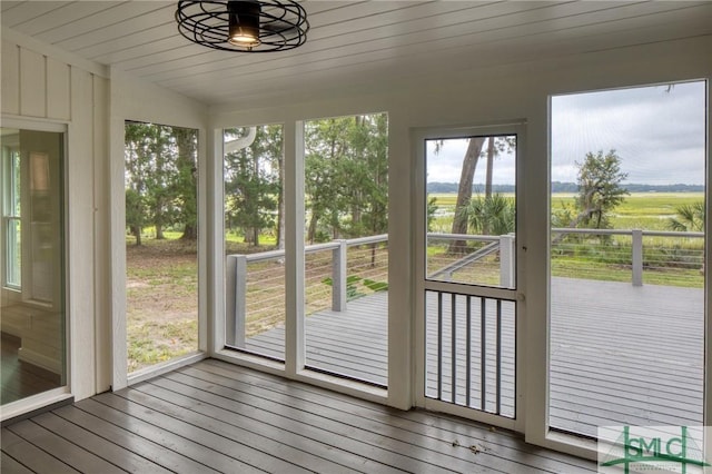 unfurnished sunroom with a rural view