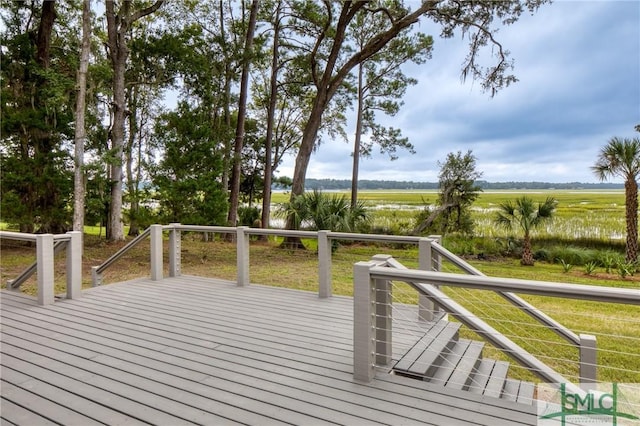 wooden deck with a rural view