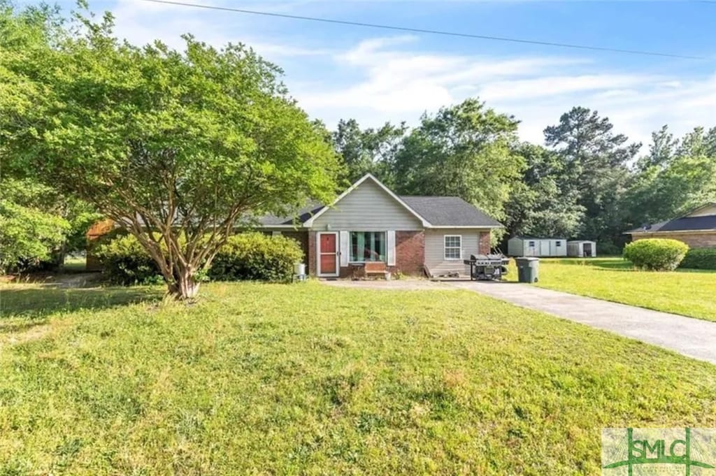 ranch-style house with a front lawn