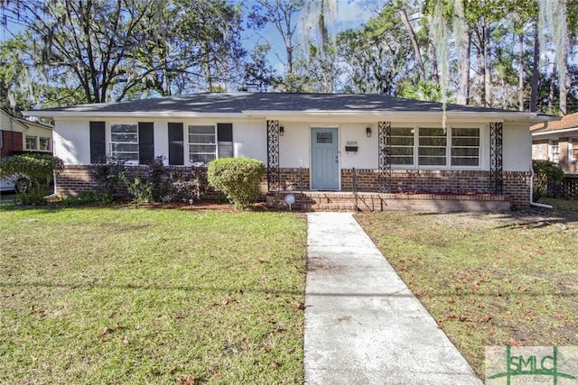 ranch-style home with a front lawn