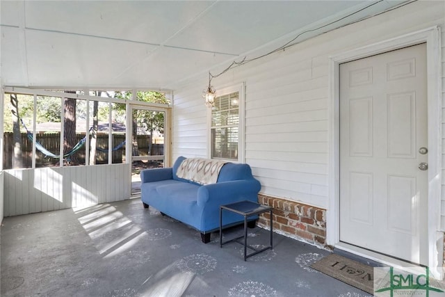 sunroom / solarium with lofted ceiling