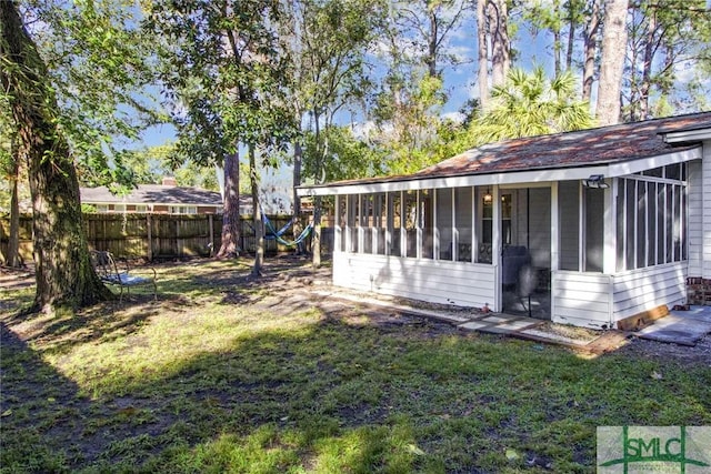 view of yard with a sunroom