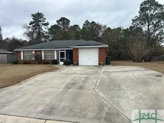 ranch-style home featuring a garage