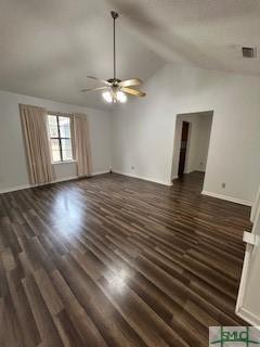 unfurnished living room featuring dark hardwood / wood-style floors, ceiling fan, and lofted ceiling