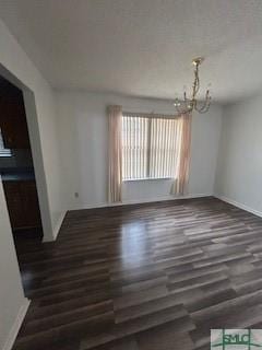 interior space featuring dark hardwood / wood-style floors and a chandelier