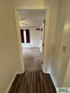 corridor featuring dark hardwood / wood-style flooring