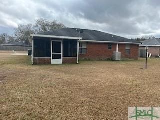 back of property featuring central AC and a sunroom