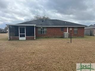 rear view of property with cooling unit