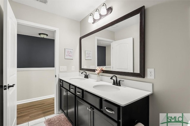 bathroom featuring tile patterned floors and vanity