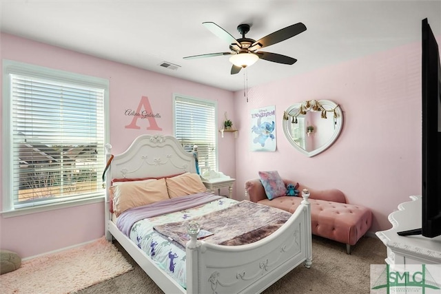 carpeted bedroom featuring ceiling fan