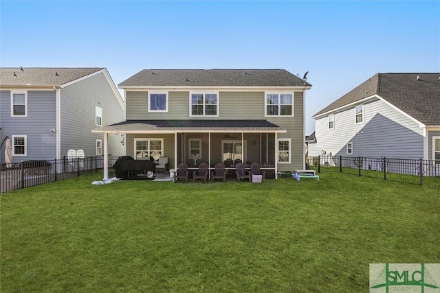 back of house with a yard and a patio