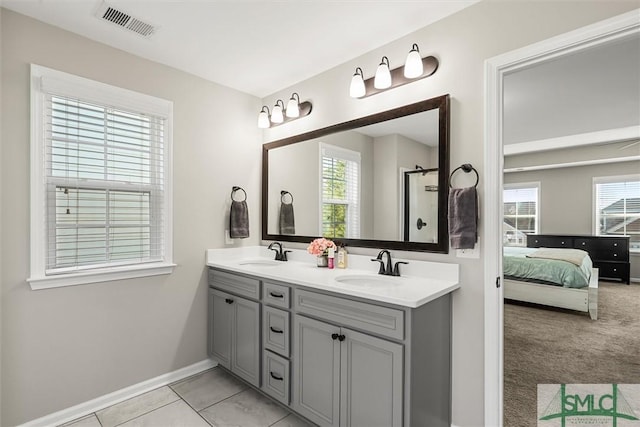 bathroom with tile patterned floors and vanity