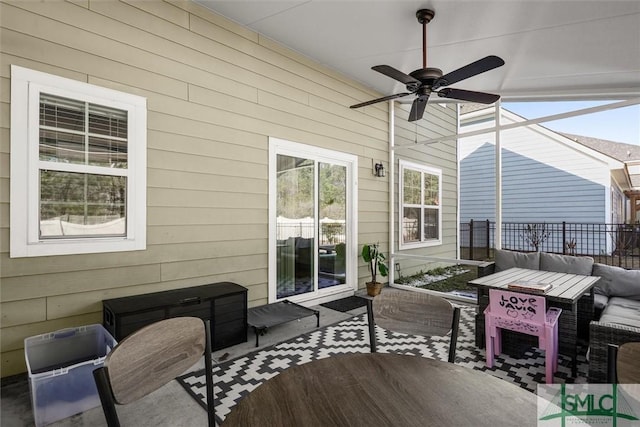 exterior space with outdoor lounge area and ceiling fan