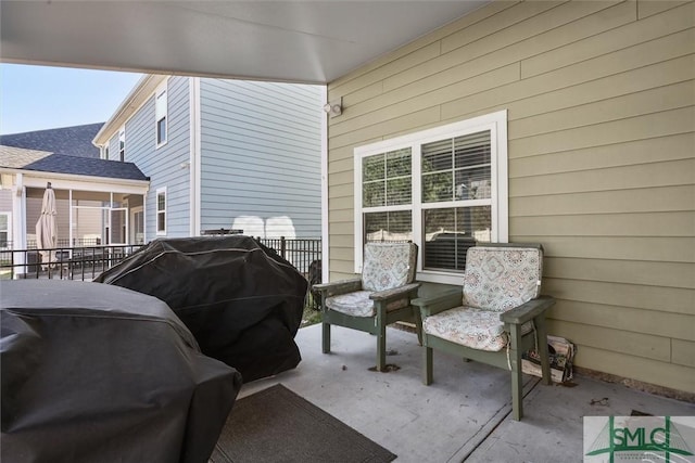 view of patio featuring a grill