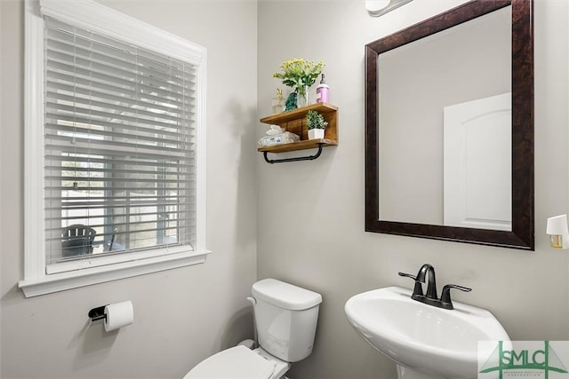 bathroom with sink and toilet