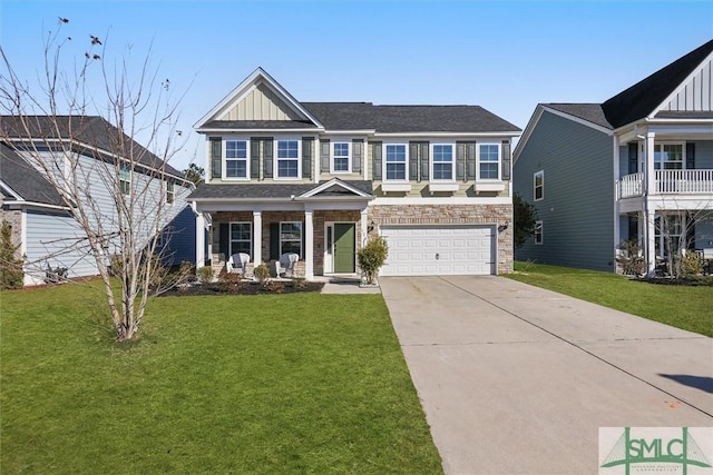 view of front of property with a front yard and a garage