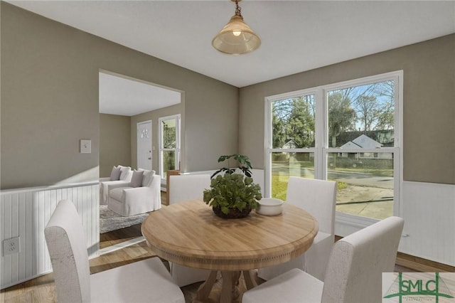 dining area with hardwood / wood-style floors