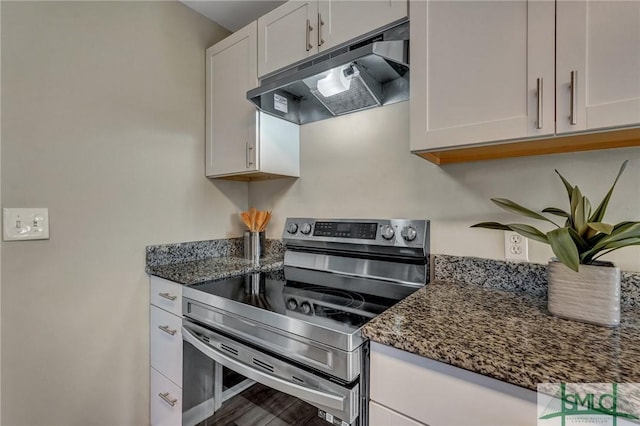 2052 E 42nd St, Savannah, GA 31404 - kitchen featuring stainless steel range with electric cooktop, range hood, white cabinetry, and dark stone countertops