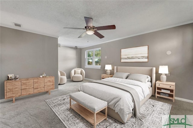 bedroom with carpet, a textured ceiling, ceiling fan, and crown molding