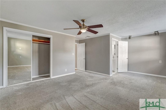 2052 E 42nd St, Savannah, GA 31404 - unfurnished bedroom featuring ornamental molding, carpet flooring, a closet, a ceiling fan, and connected bathroom
