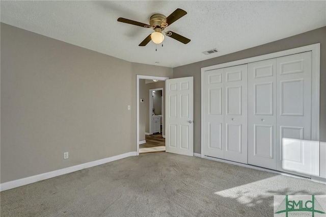2052 E 42nd St, Savannah, GA 31404 - unfurnished bedroom with carpet floors, a closet, ceiling fan, and a textured ceiling