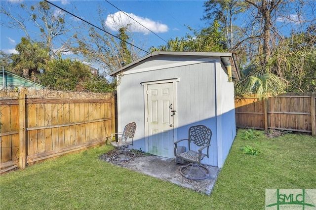 view of outdoor structure featuring a lawn