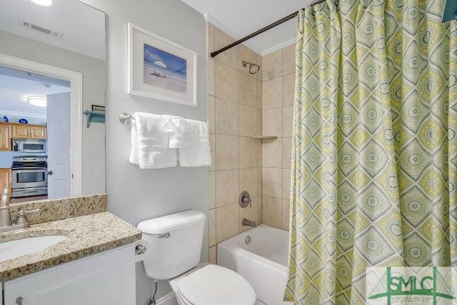 full bathroom with shower / tub combo, vanity, and toilet