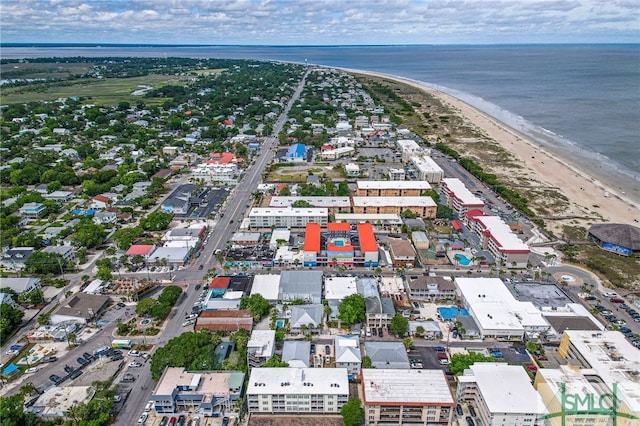 birds eye view of property featuring a view of the beach and a water view