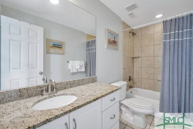 full bathroom featuring tile patterned flooring, shower / bath combo, vanity, and toilet