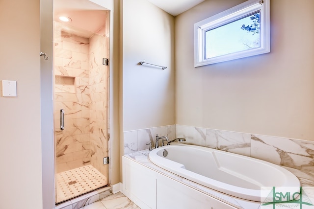 full bathroom with marble finish floor, a stall shower, and a garden tub