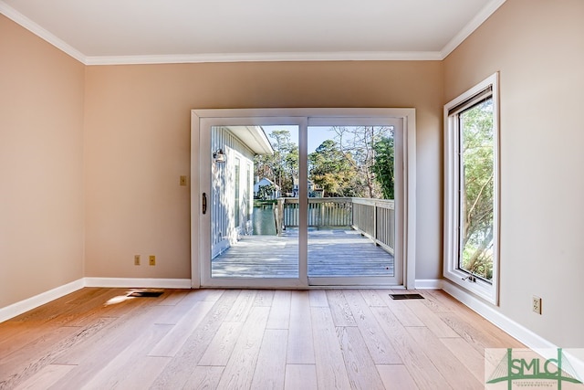 doorway to outside with light hardwood / wood-style floors and ornamental molding