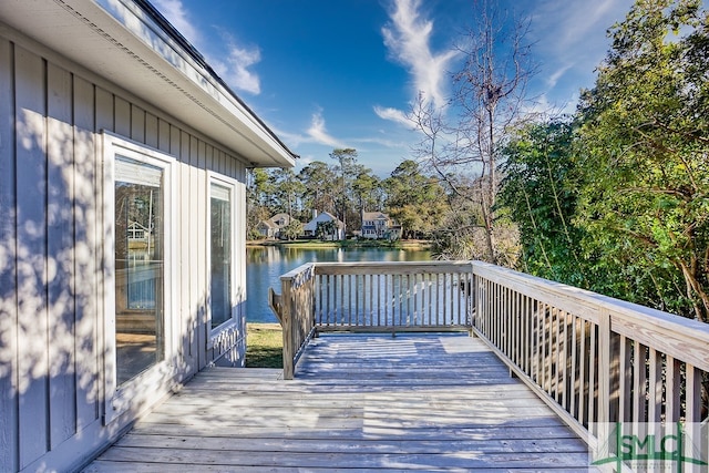 wooden terrace with a water view