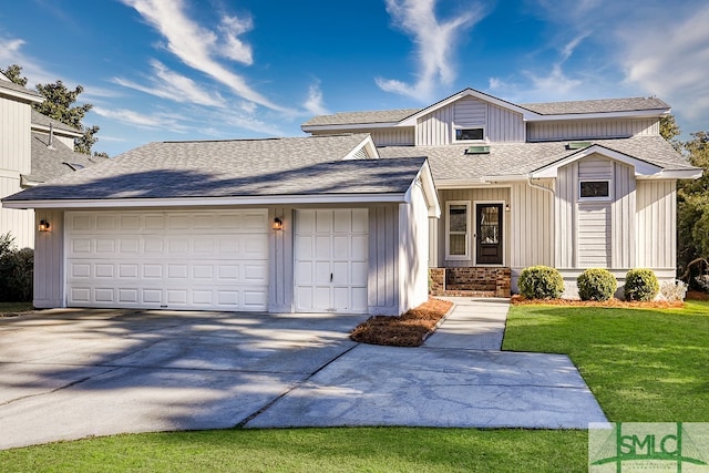 view of front of home with a garage, driveway, roof with shingles, and a front yard