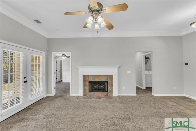 unfurnished living room with carpet flooring, a fireplace, and ornamental molding