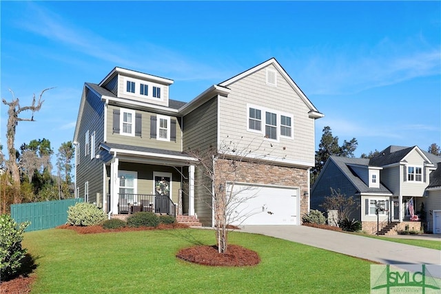 view of front of house with a porch, a garage, and a front yard