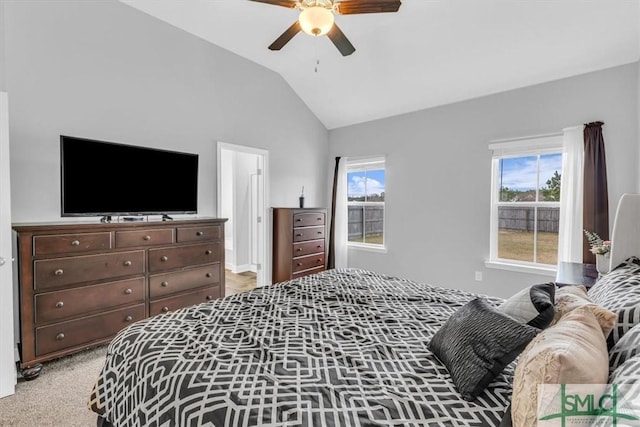 carpeted bedroom with ceiling fan and lofted ceiling