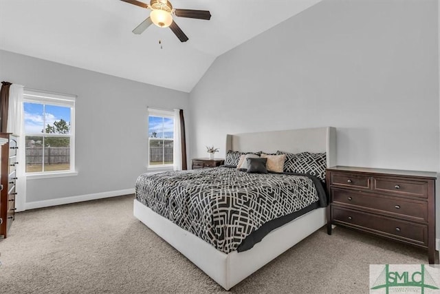 carpeted bedroom featuring vaulted ceiling and ceiling fan